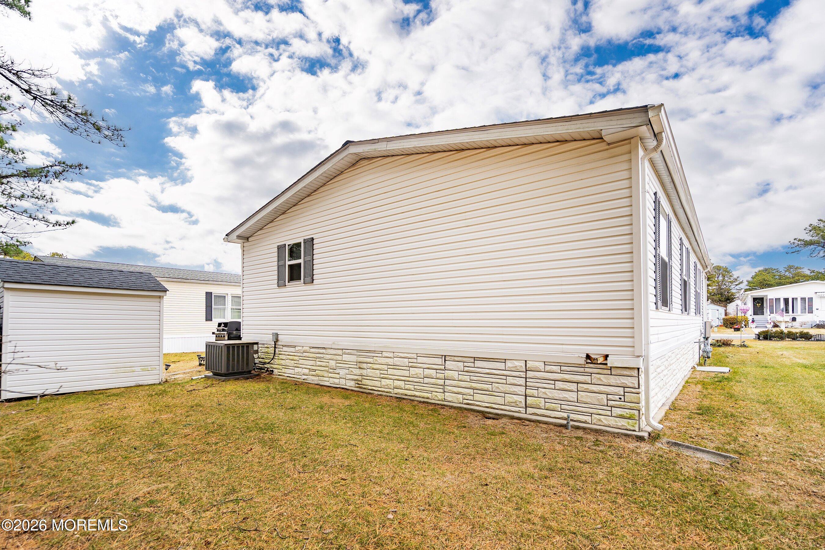 536 Momosa Way Whiting, NJ 08759 - Photo 28 of 54 a view of a backyard with a large tree