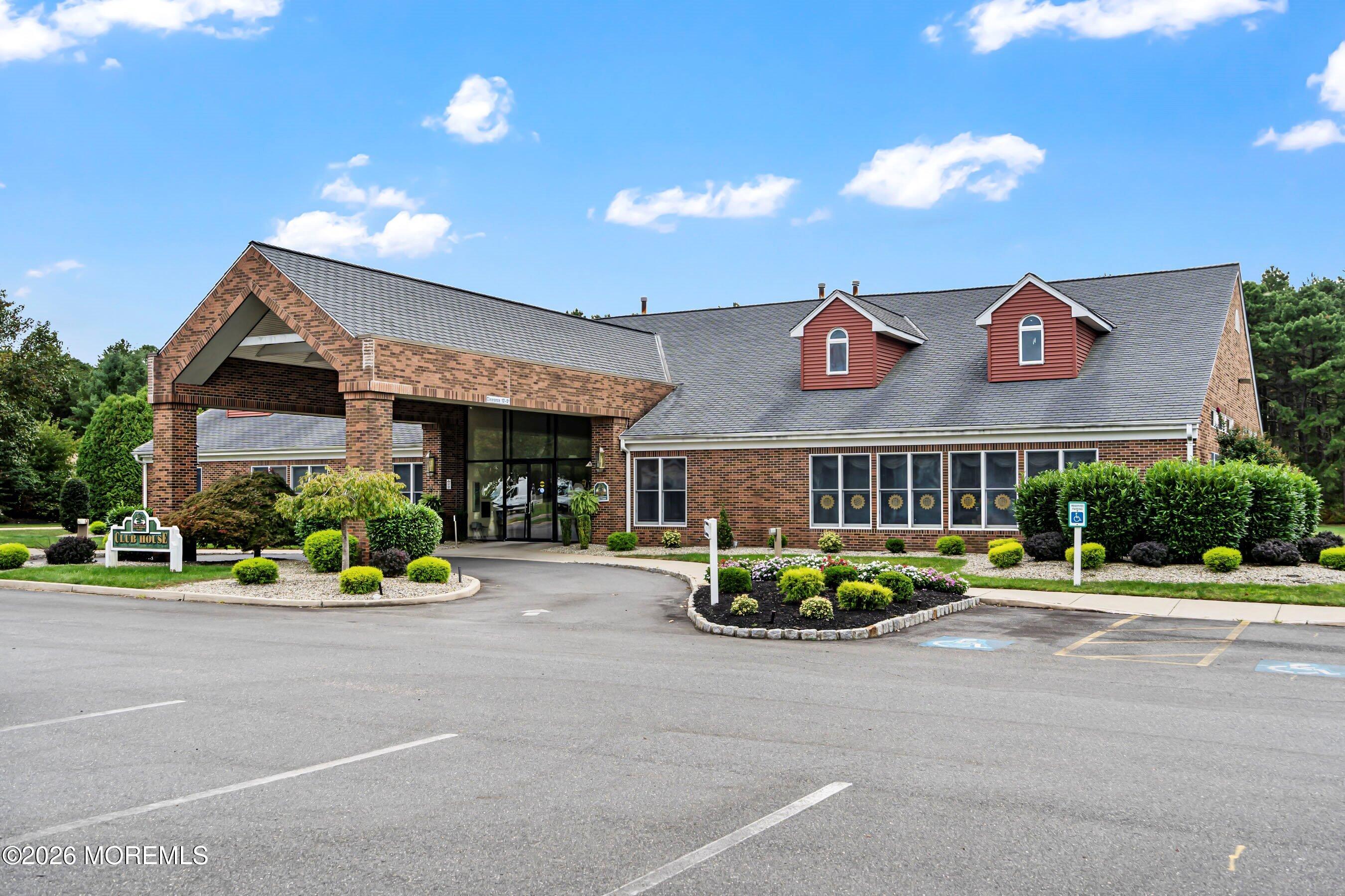 536 Momosa Way Whiting, NJ 08759 - Photo 39 of 54 a front view of a building with a garden