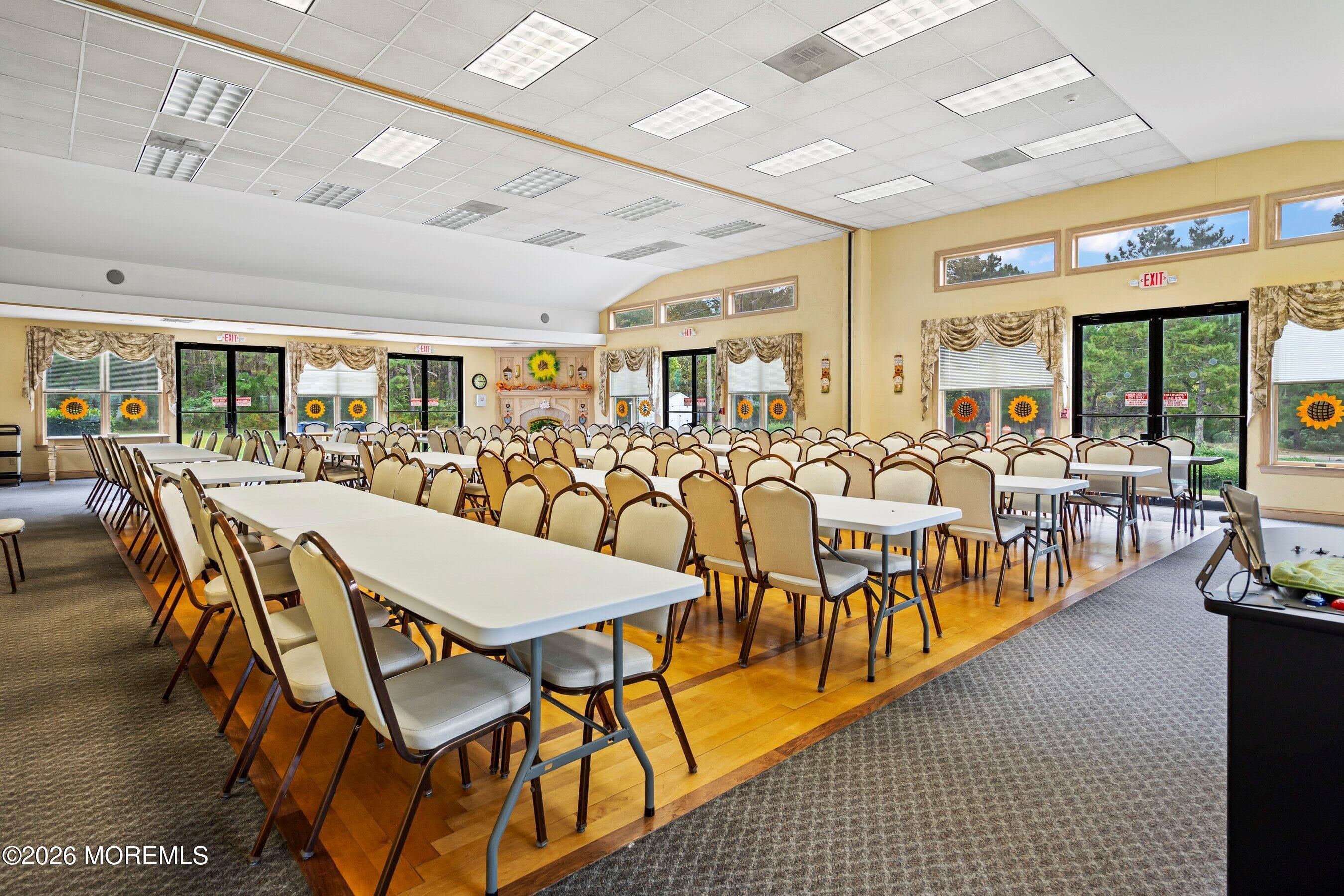 536 Momosa Way Whiting, NJ 08759 - Photo 44 of 54 a dining hall with lots of chairs and a dining table with wooden floor
