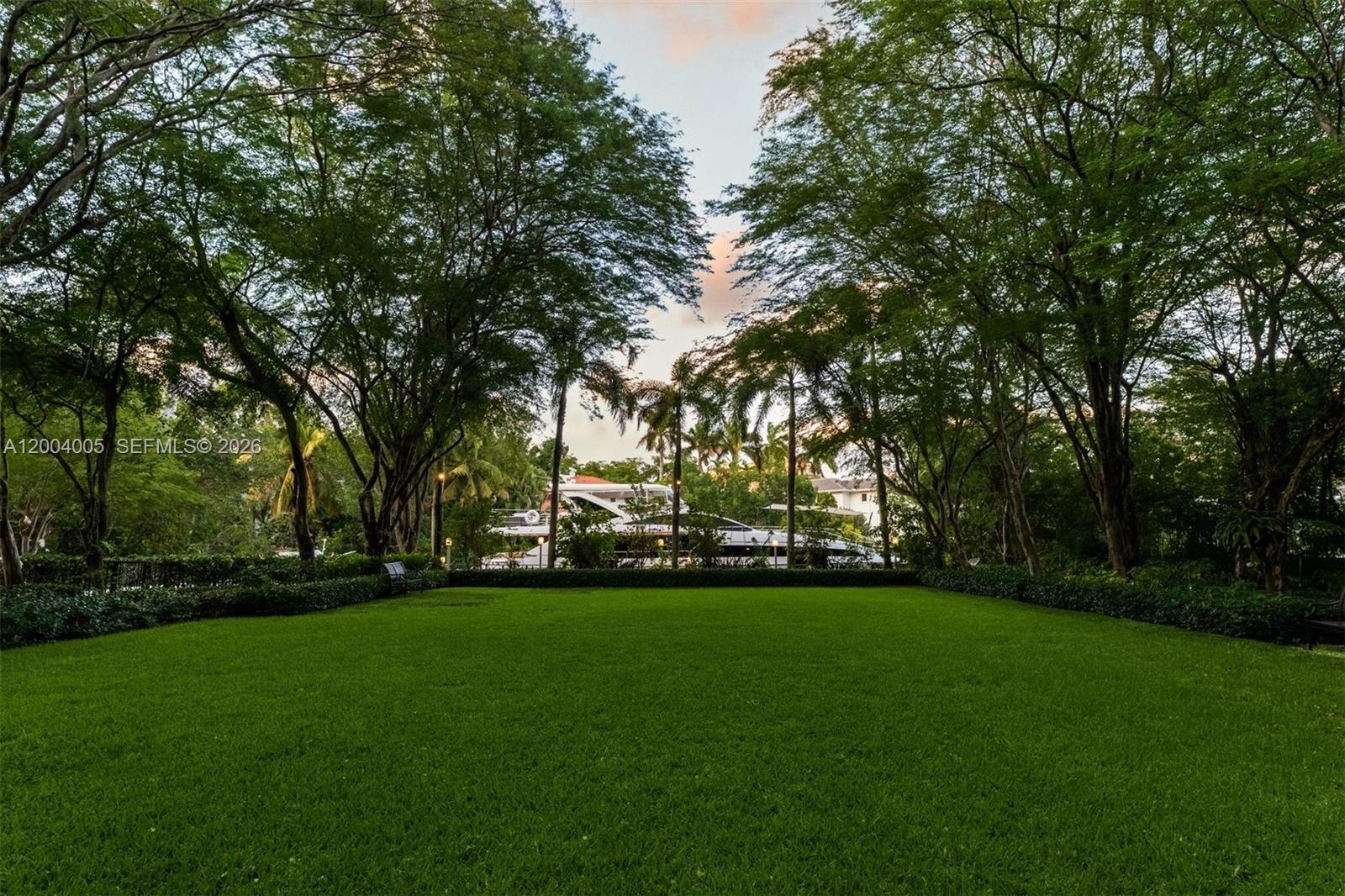 255 Cocoplum Road Coral Gables, FL 33143 - Photo 12 of 29 a garden view with trees