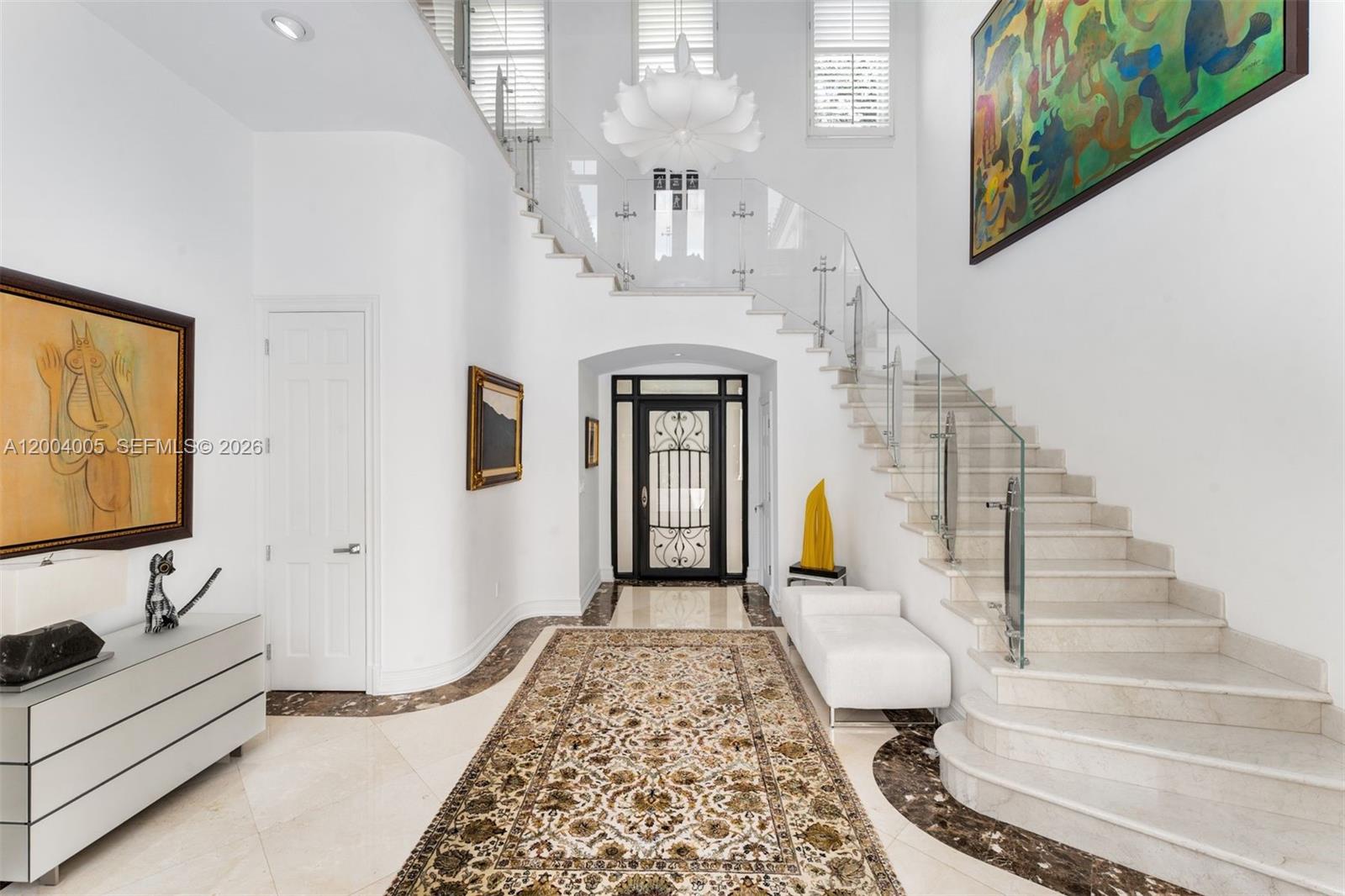 255 Cocoplum Road Coral Gables, FL 33143 - Photo 13 of 29 a view of entryway and hall with wooden floor