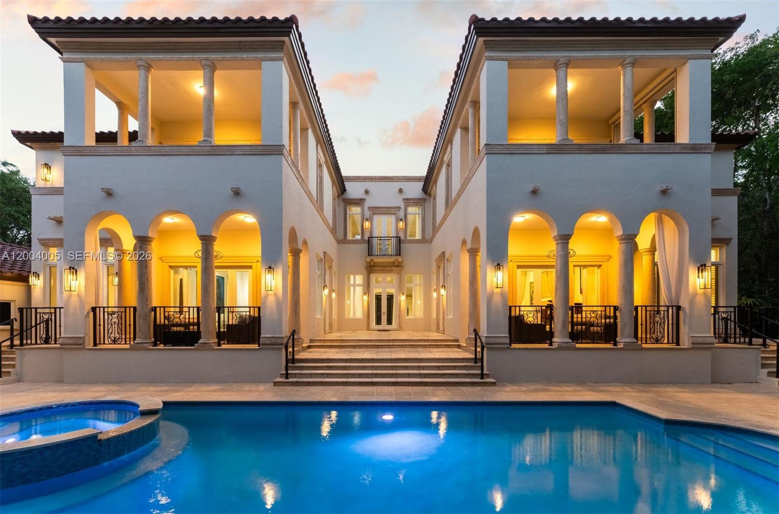 255 Cocoplum Road Coral Gables, FL 33143 - Photo 14 of 29 a view of building with a floor to ceiling window