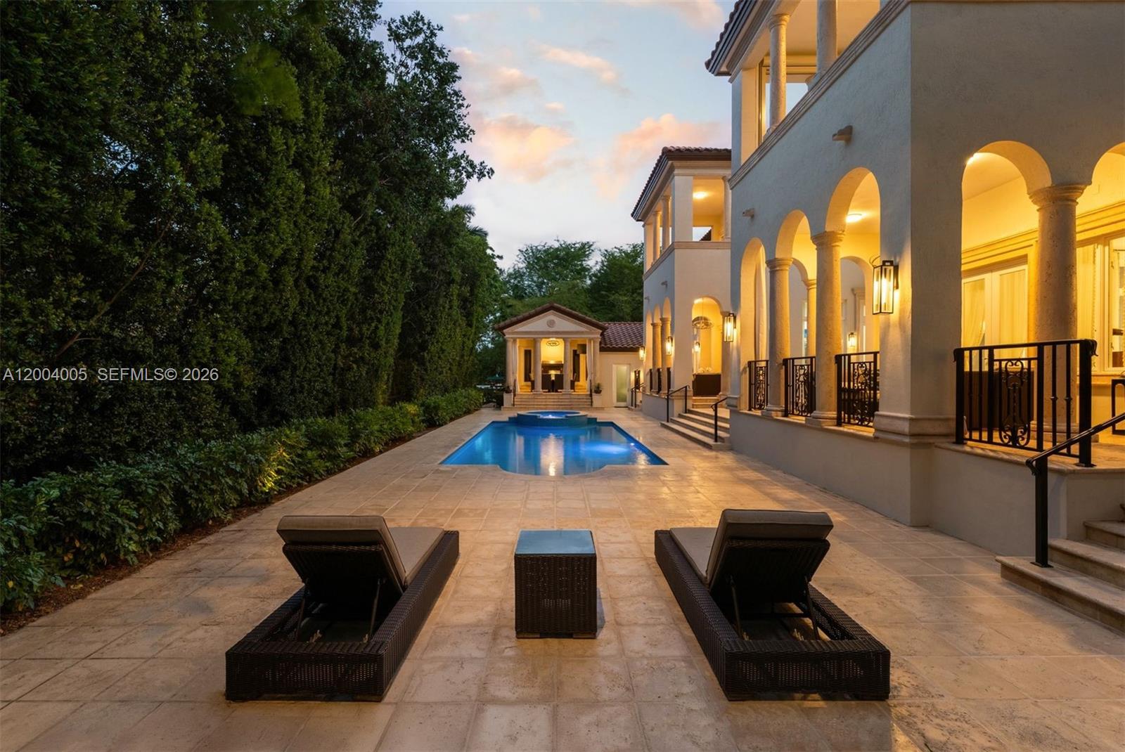 255 Cocoplum Road Coral Gables, FL 33143 - Photo 16 of 29 a swimming pool with outdoor seating and yard
