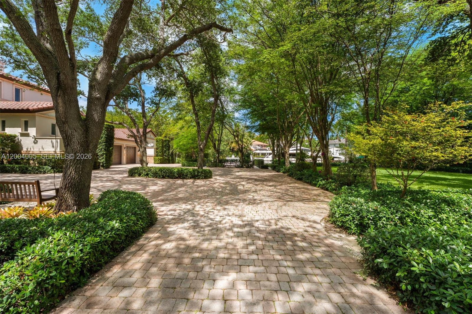 255 Cocoplum Road Coral Gables, FL 33143 - Photo 18 of 29 a view of backyard with tree