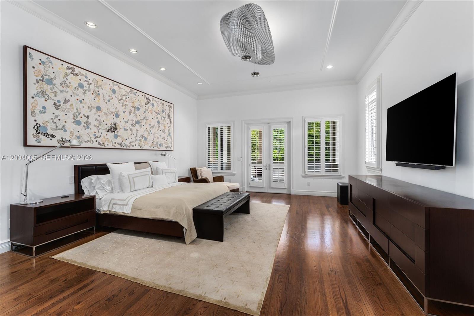 255 Cocoplum Road Coral Gables, FL 33143 - Photo 21 of 29 a living room with furniture and a flat screen tv