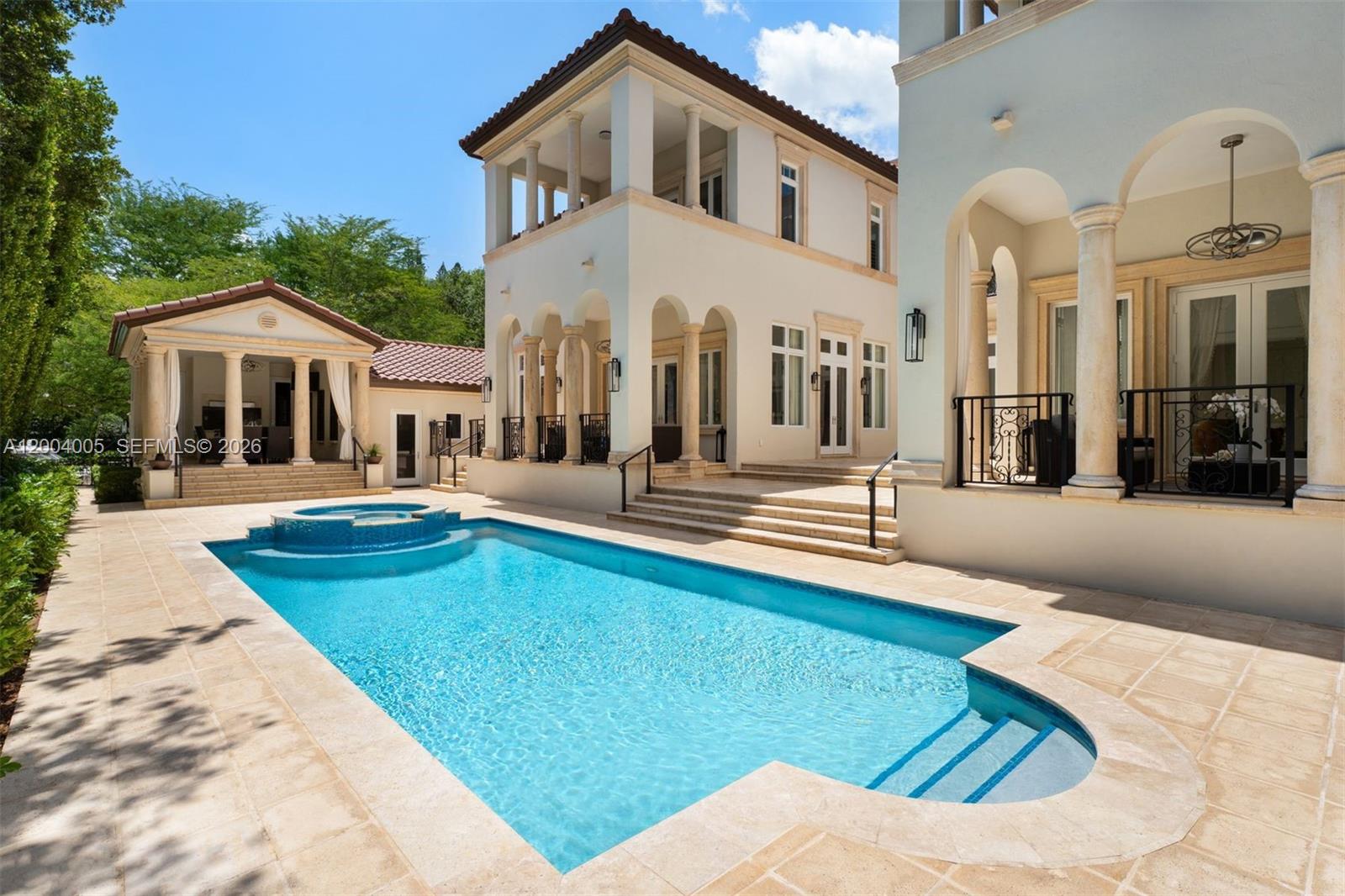 255 Cocoplum Road Coral Gables, FL 33143 - Photo 24 of 29 a front view of a house with swimming pool