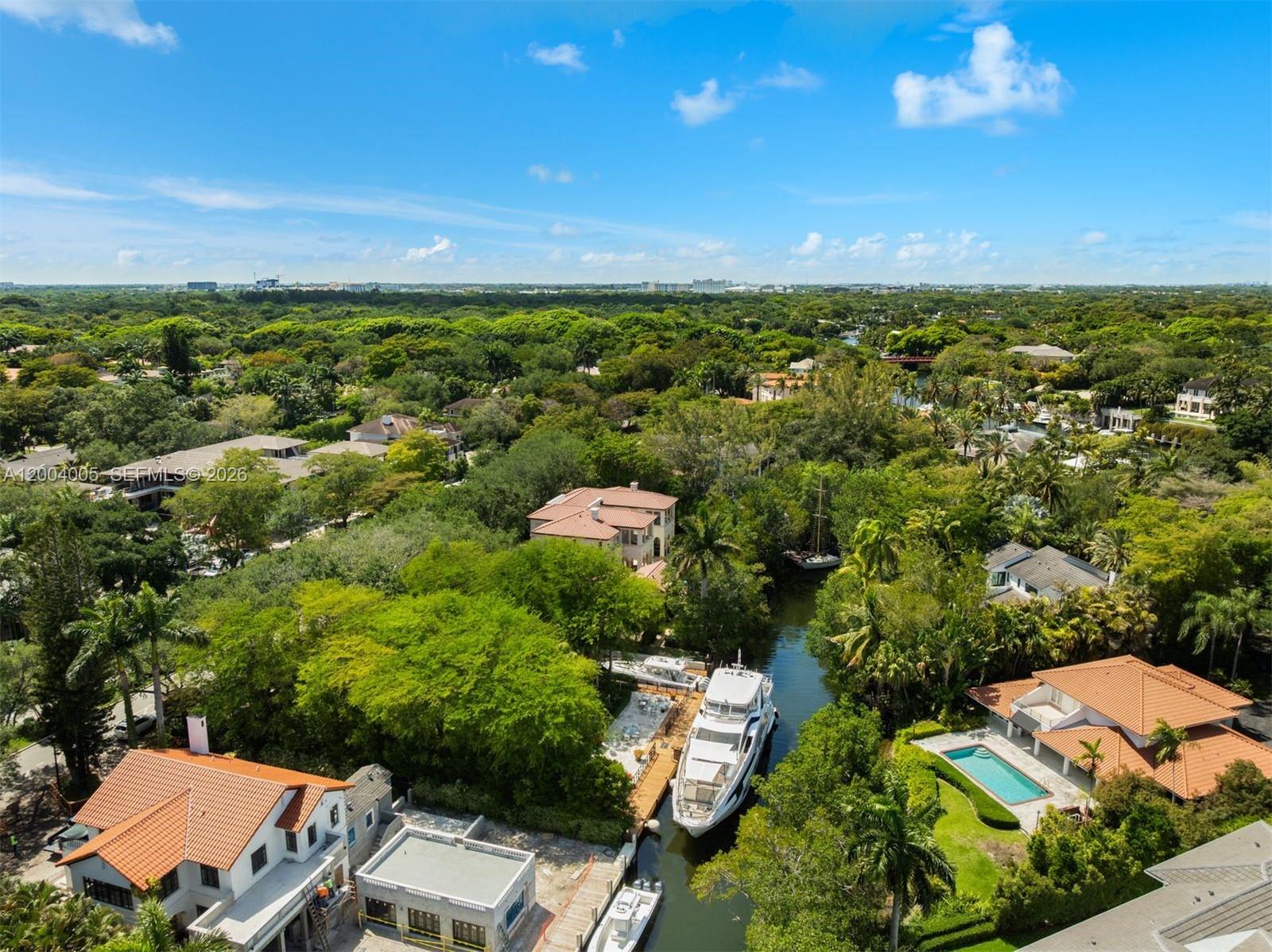 255 Cocoplum Road Coral Gables, FL 33143 - Photo 26 of 29 an aerial view of residential houses with outdoor space and trees