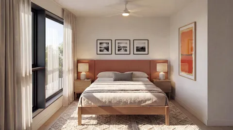 a bedroom with a large bed and a chandelier