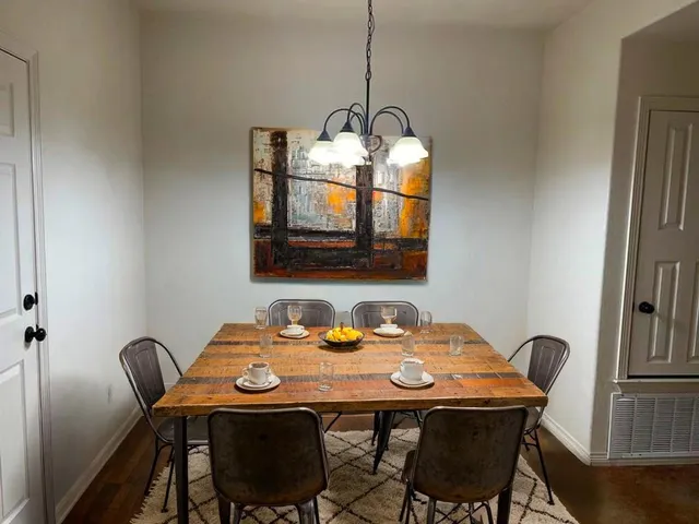a dining room with furniture and window