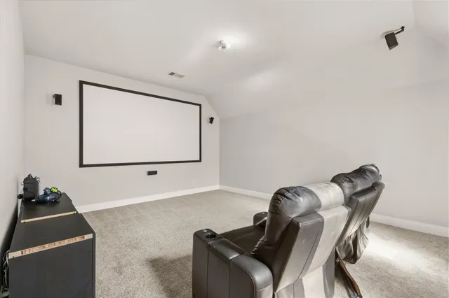 a room with furniture and a flat screen tv
