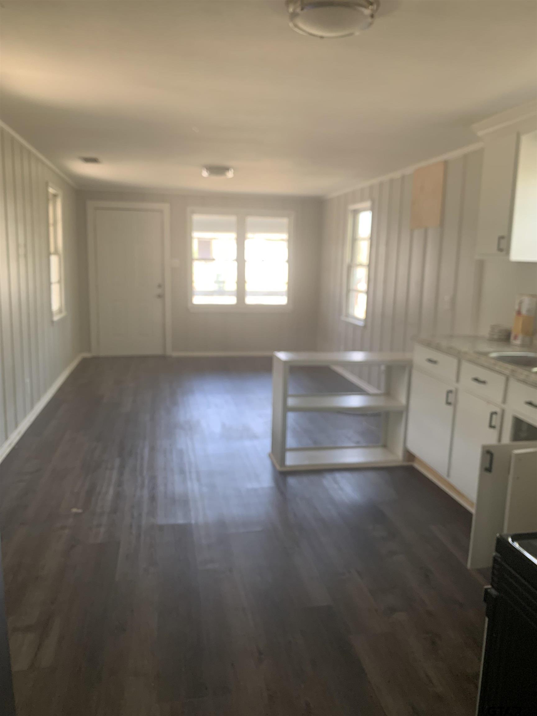 2722 Bunche Street Tyler, TX 75701 - Photo 3 of 6 a view of empty room with wooden floor and fan