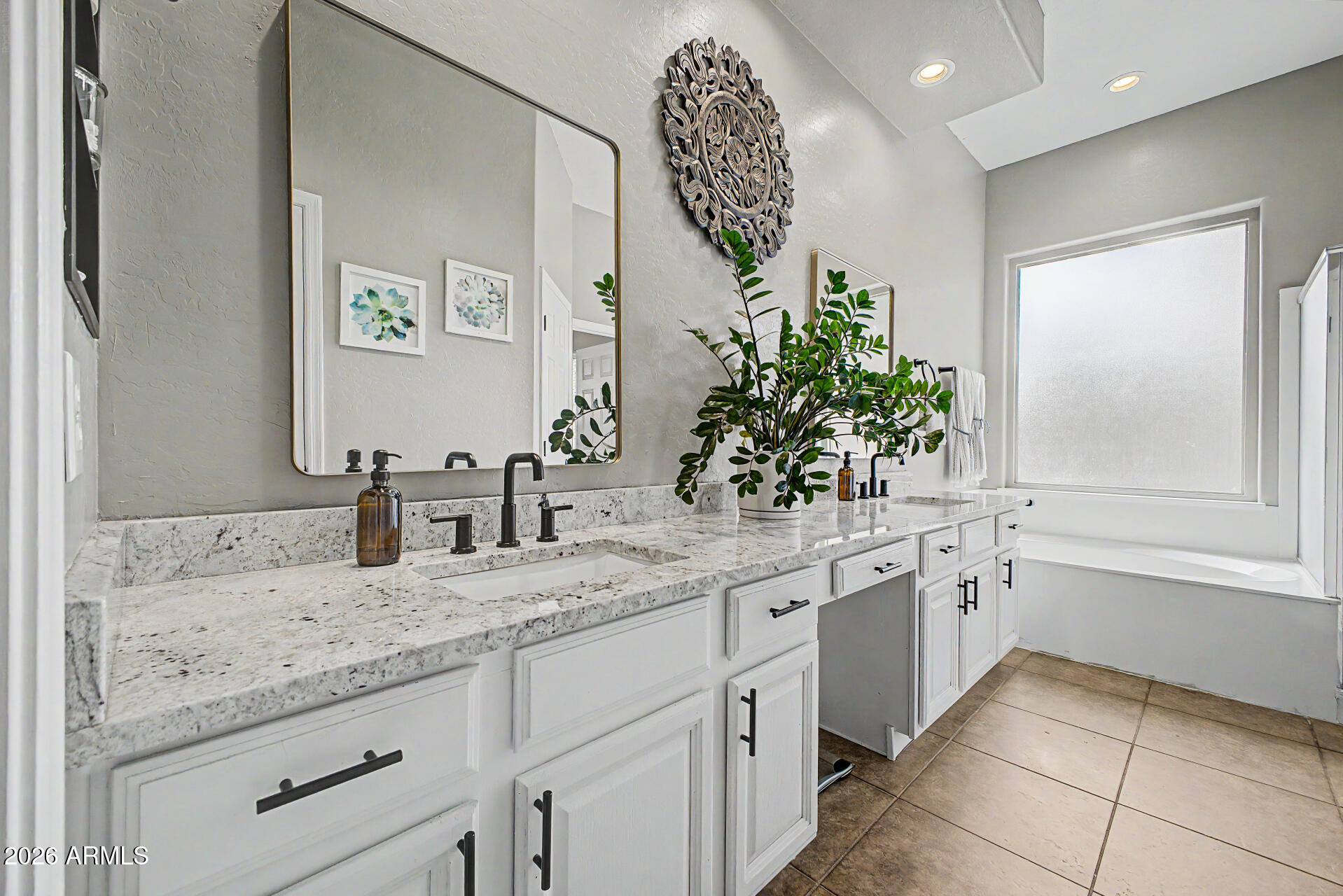 4272 East Buckboard Road Gilbert, AZ 85297 - Photo 21 of 37 a bathroom with a granite countertop sink and a mirror
