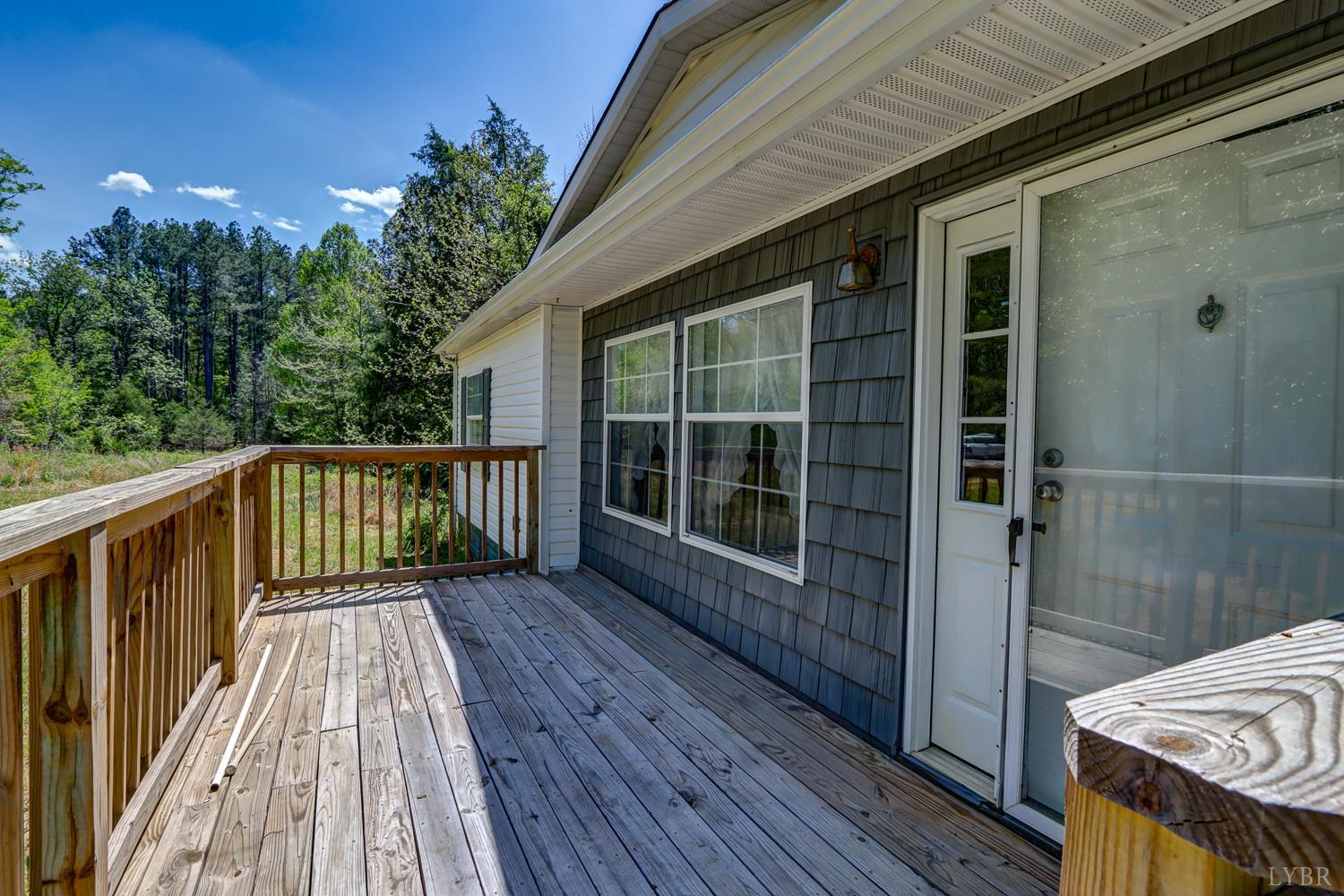 102 Slow Water Court Sandy Level, VA 24161 - Photo 2 of 66 a view of balcony with wooden floor and fence