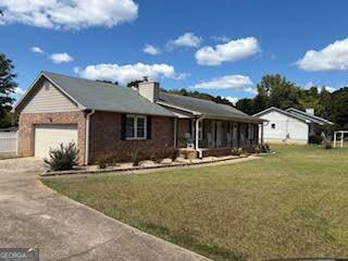 545 Southmoor Circle Stockbridge, GA 30281 - Photo 2 of 19 front view of a house with a yard