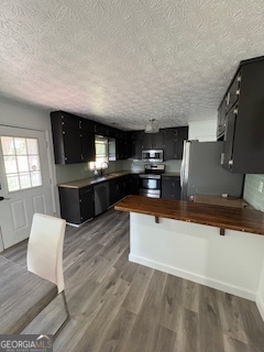 545 Southmoor Circle Stockbridge, GA 30281 - Photo 4 of 19 a living room with stainless steel appliances kitchen island granite countertop a sink and a wooden floors