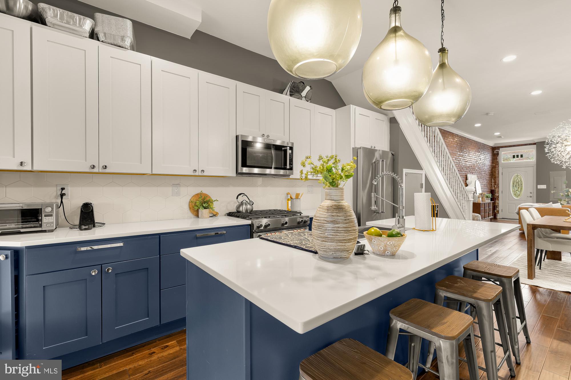 421 10th Street Northeast Washington, DC 20002 - Photo 16 of 61 a kitchen with a sink a stove cabinets and wooden floor
