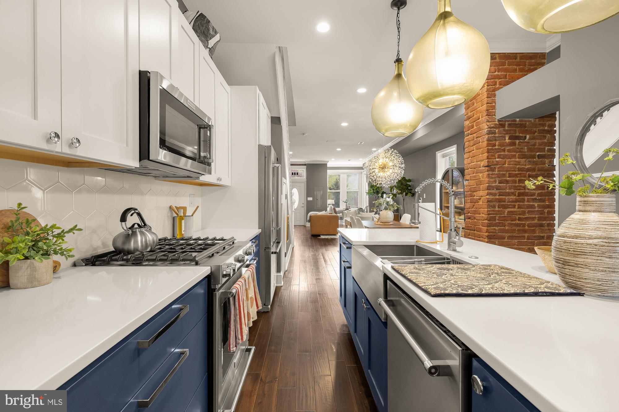 421 10th Street Northeast Washington, DC 20002 - Photo 18 of 61 a kitchen with stainless steel appliances granite countertop a sink stove and cabinets