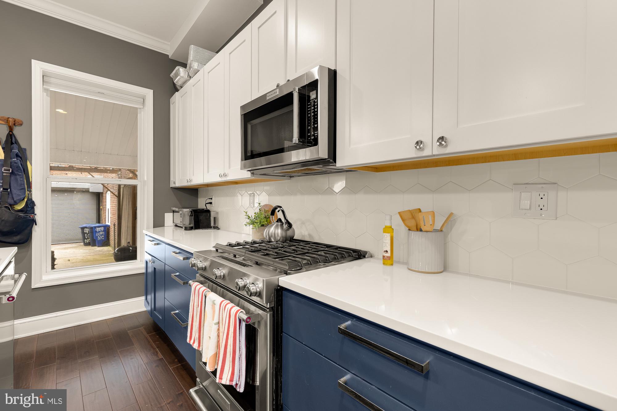421 10th Street Northeast Washington, DC 20002 - Photo 20 of 61 a kitchen with stainless steel appliances granite countertop a sink and a stove
