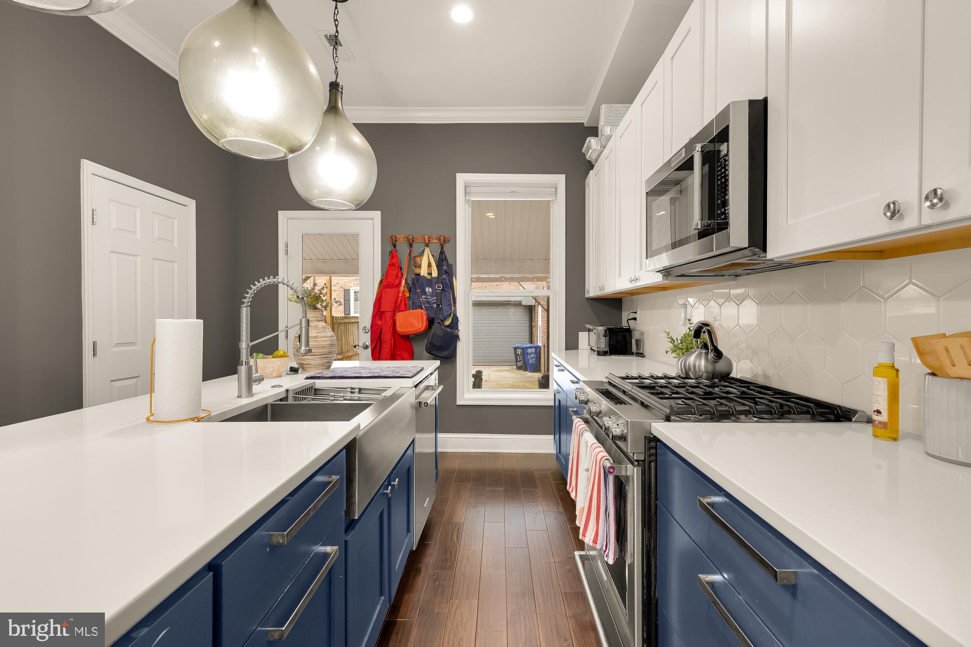 421 10th Street Northeast Washington, DC 20002 - Photo 21 of 61 a kitchen with stainless steel appliances granite countertop a stove and a sink