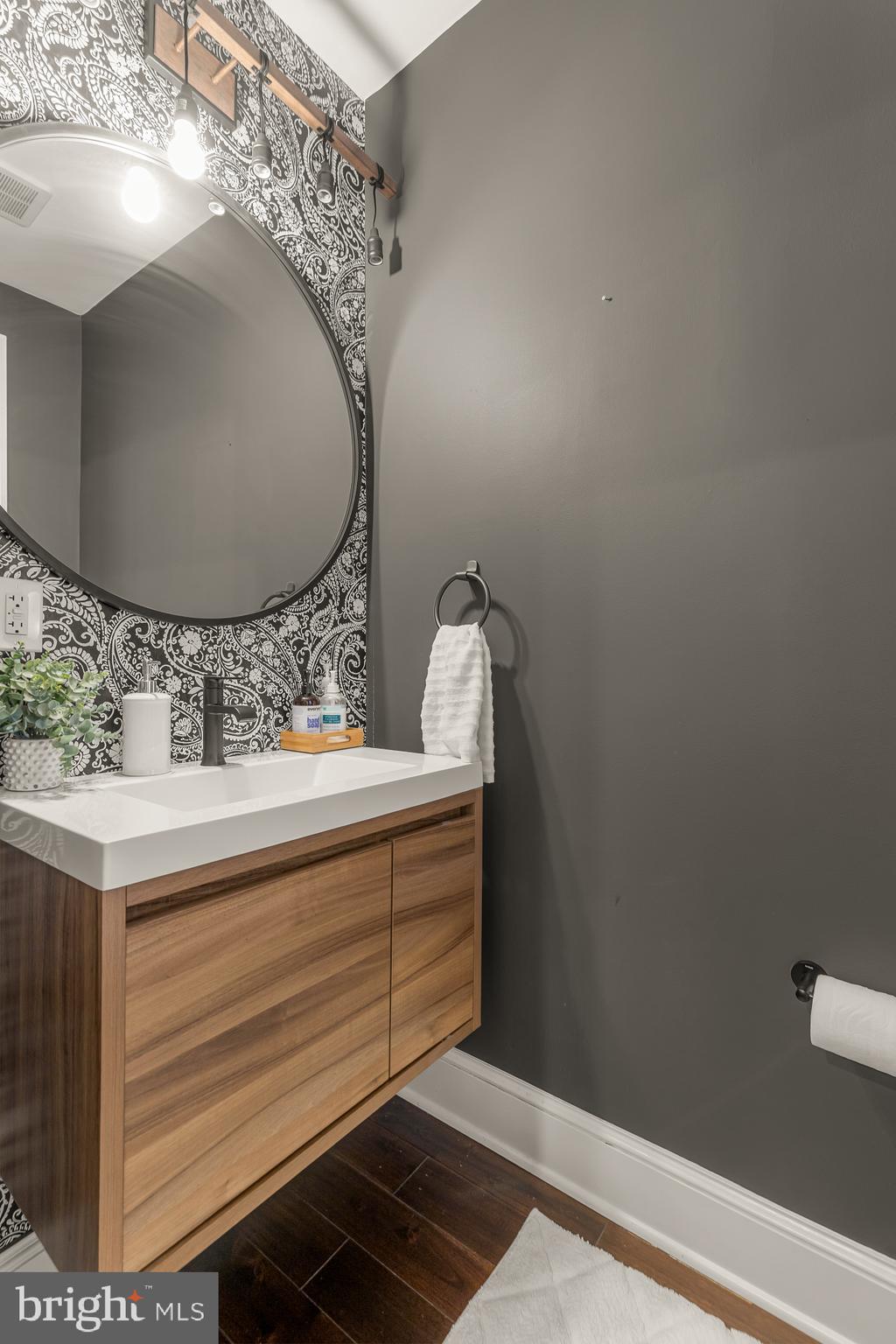 421 10th Street Northeast Washington, DC 20002 - Photo 24 of 61 a bathroom with a sink and mirror