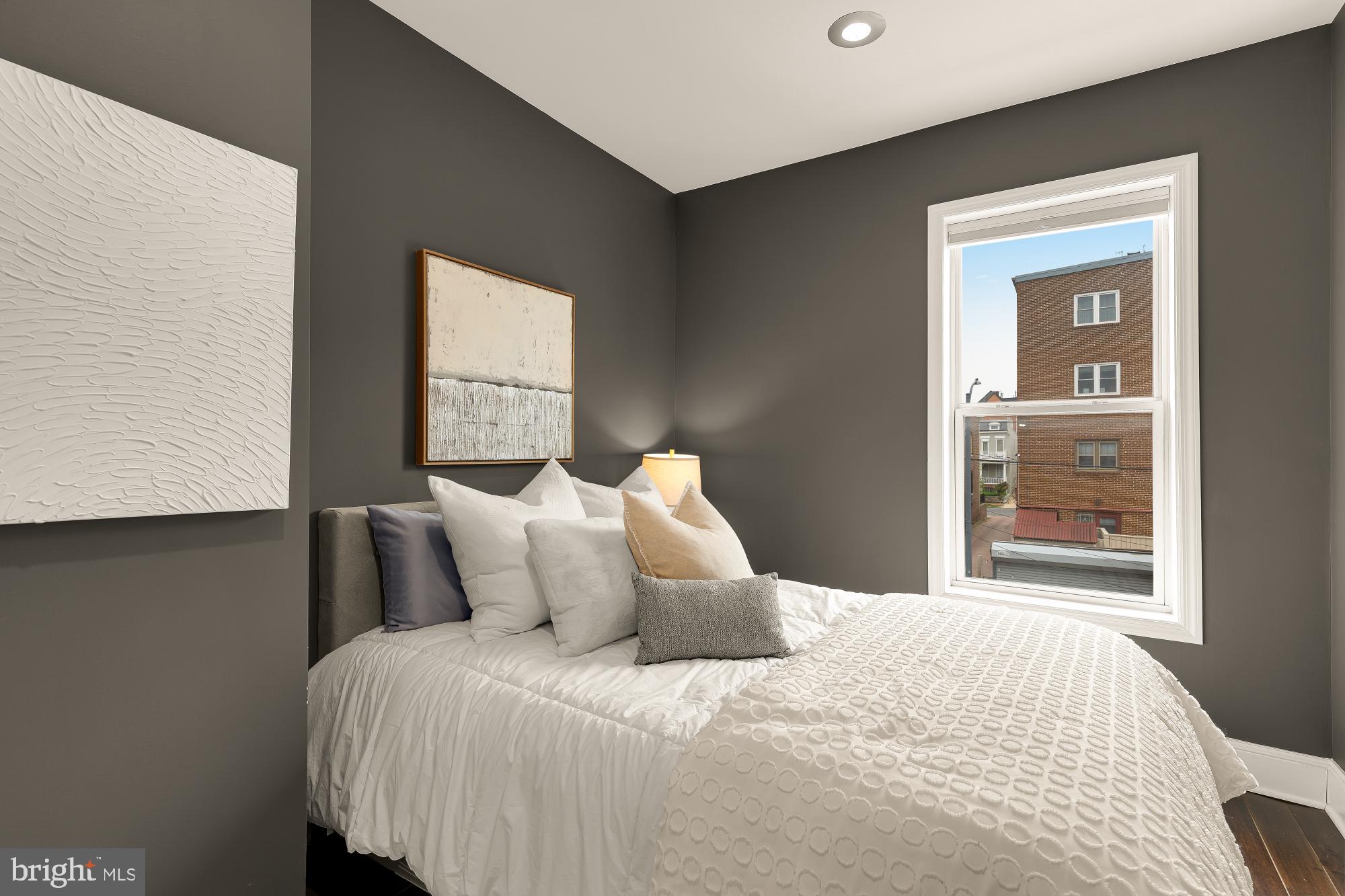 421 10th Street Northeast Washington, DC 20002 - Photo 28 of 61 a bedroom with a bed and window