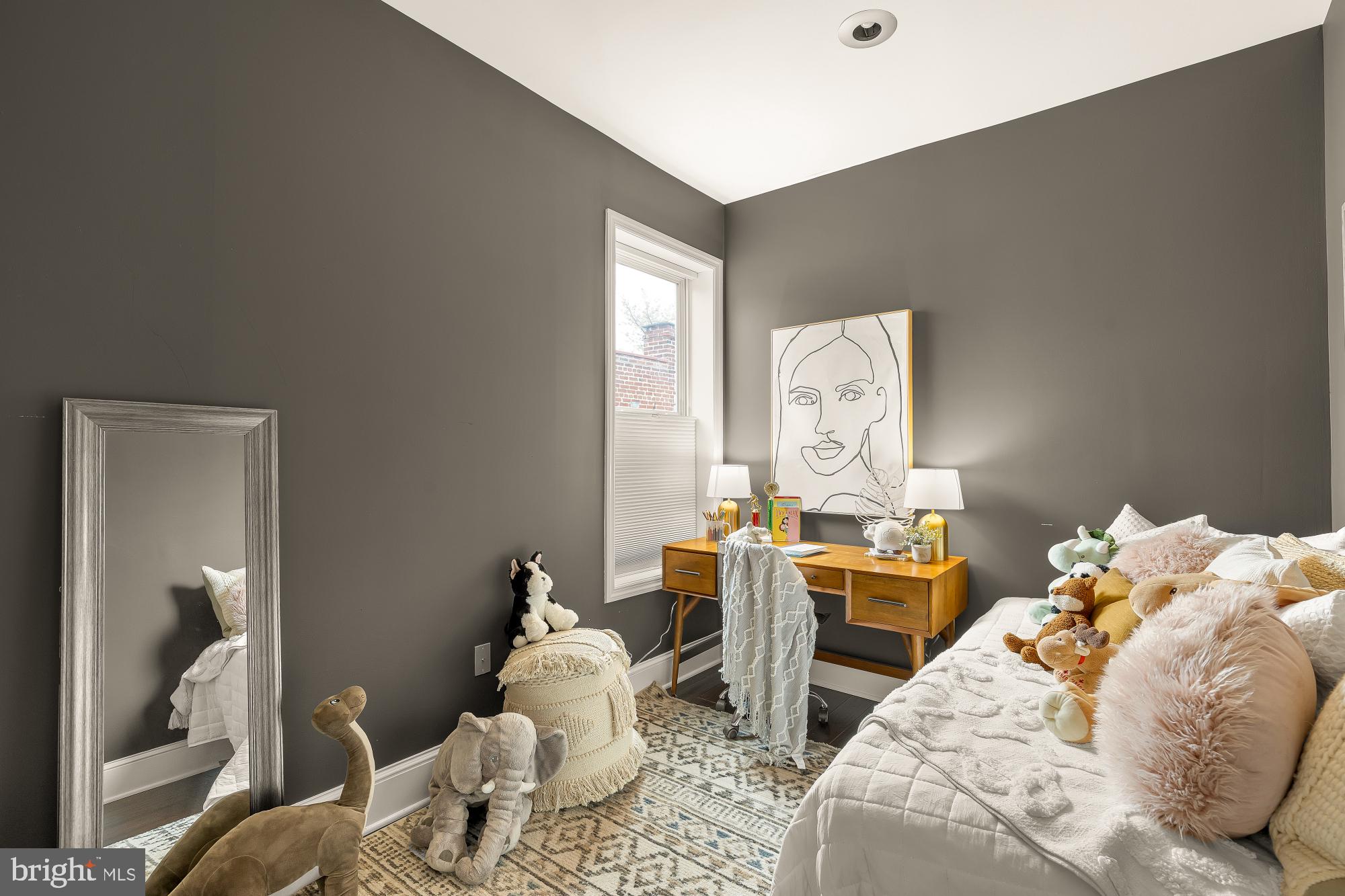 421 10th Street Northeast Washington, DC 20002 - Photo 31 of 61 a bed room with a bed and a chandelier