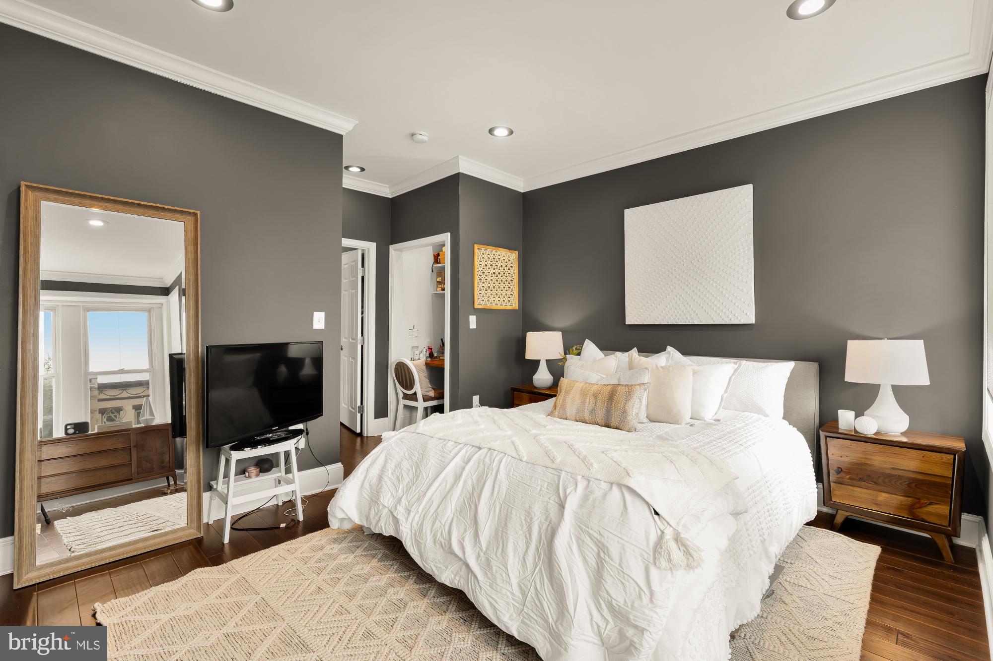 421 10th Street Northeast Washington, DC 20002 - Photo 39 of 61 a bedroom with a bed and a flat screen tv