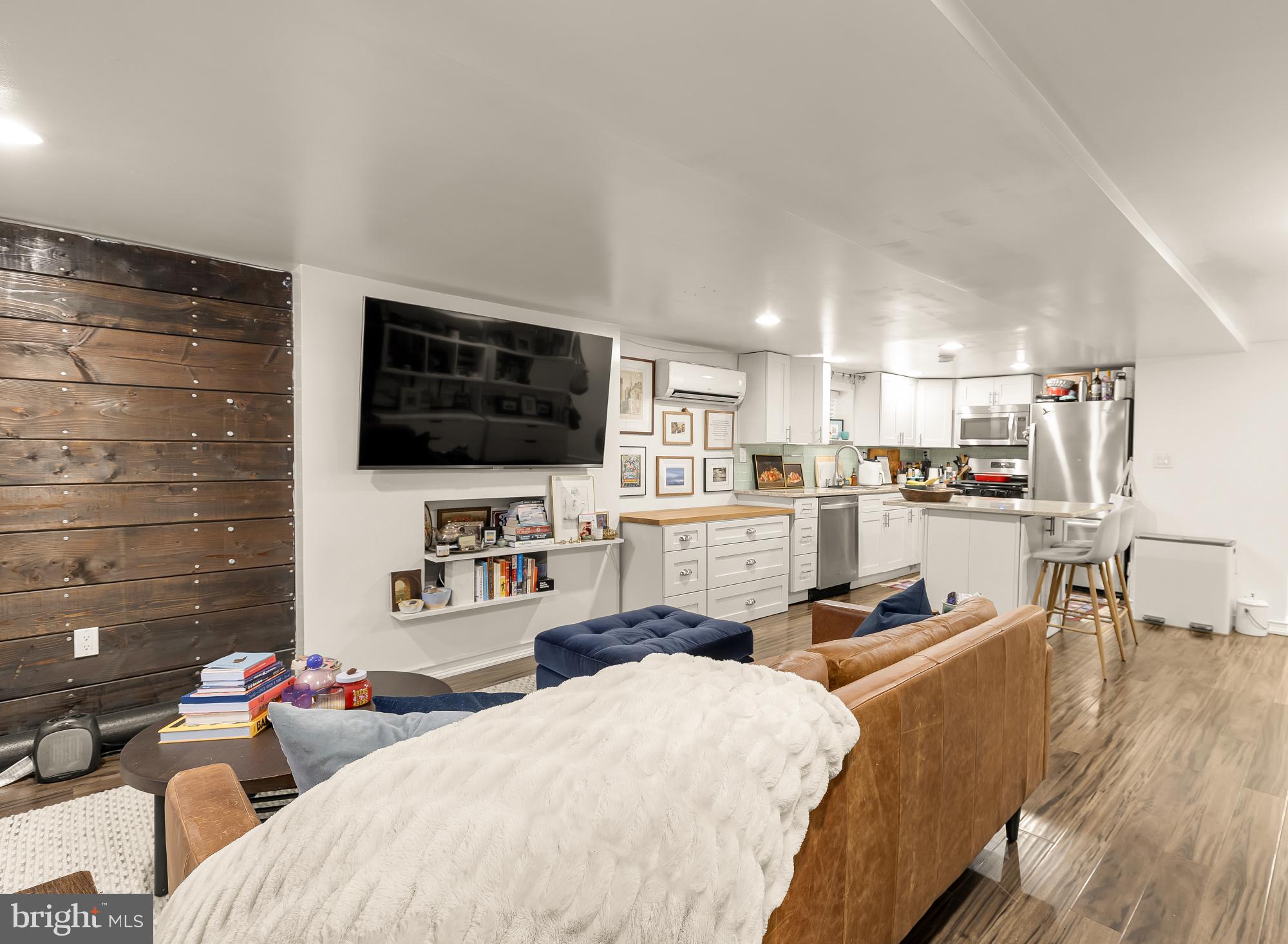 421 10th Street Northeast Washington, DC 20002 - Photo 40 of 61 a living room with stainless steel appliances furniture and a flat screen tv