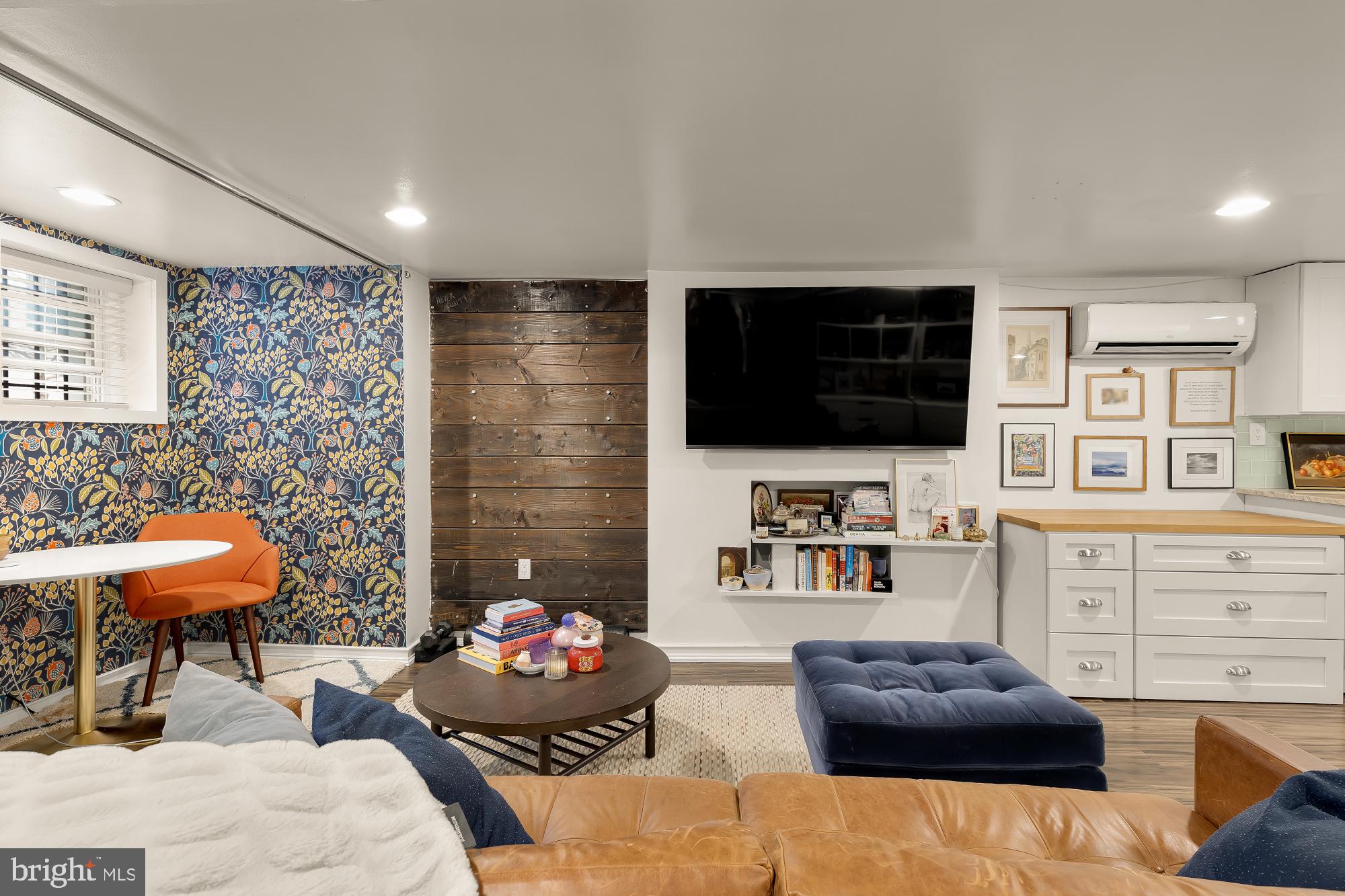 421 10th Street Northeast Washington, DC 20002 - Photo 41 of 61 a living room with furniture and a flat screen tv