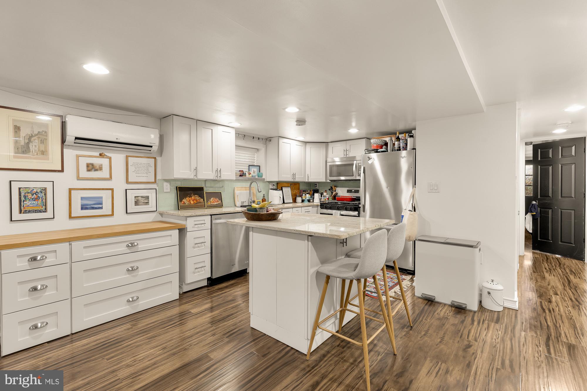 421 10th Street Northeast Washington, DC 20002 - Photo 45 of 61 a kitchen with white cabinets and refrigerator