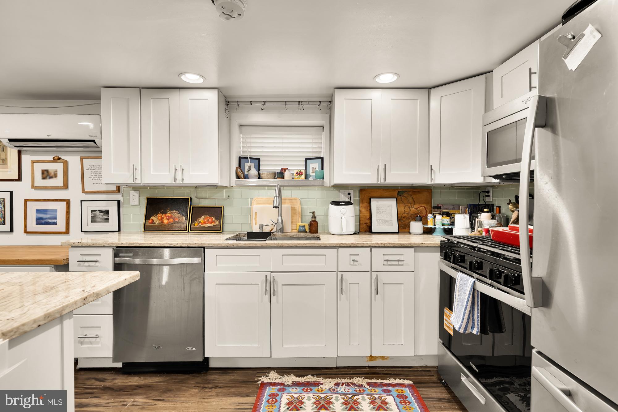 421 10th Street Northeast Washington, DC 20002 - Photo 48 of 61 a kitchen with stainless steel appliances a stove a sink and a refrigerator