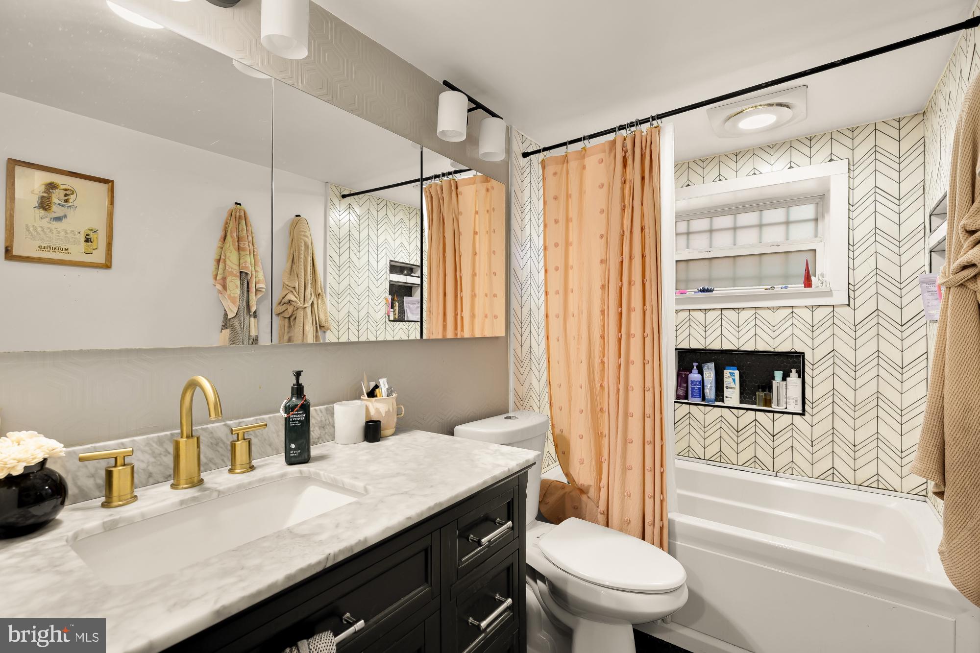 421 10th Street Northeast Washington, DC 20002 - Photo 58 of 61 a bathroom with a granite countertop sink a toilet and shower