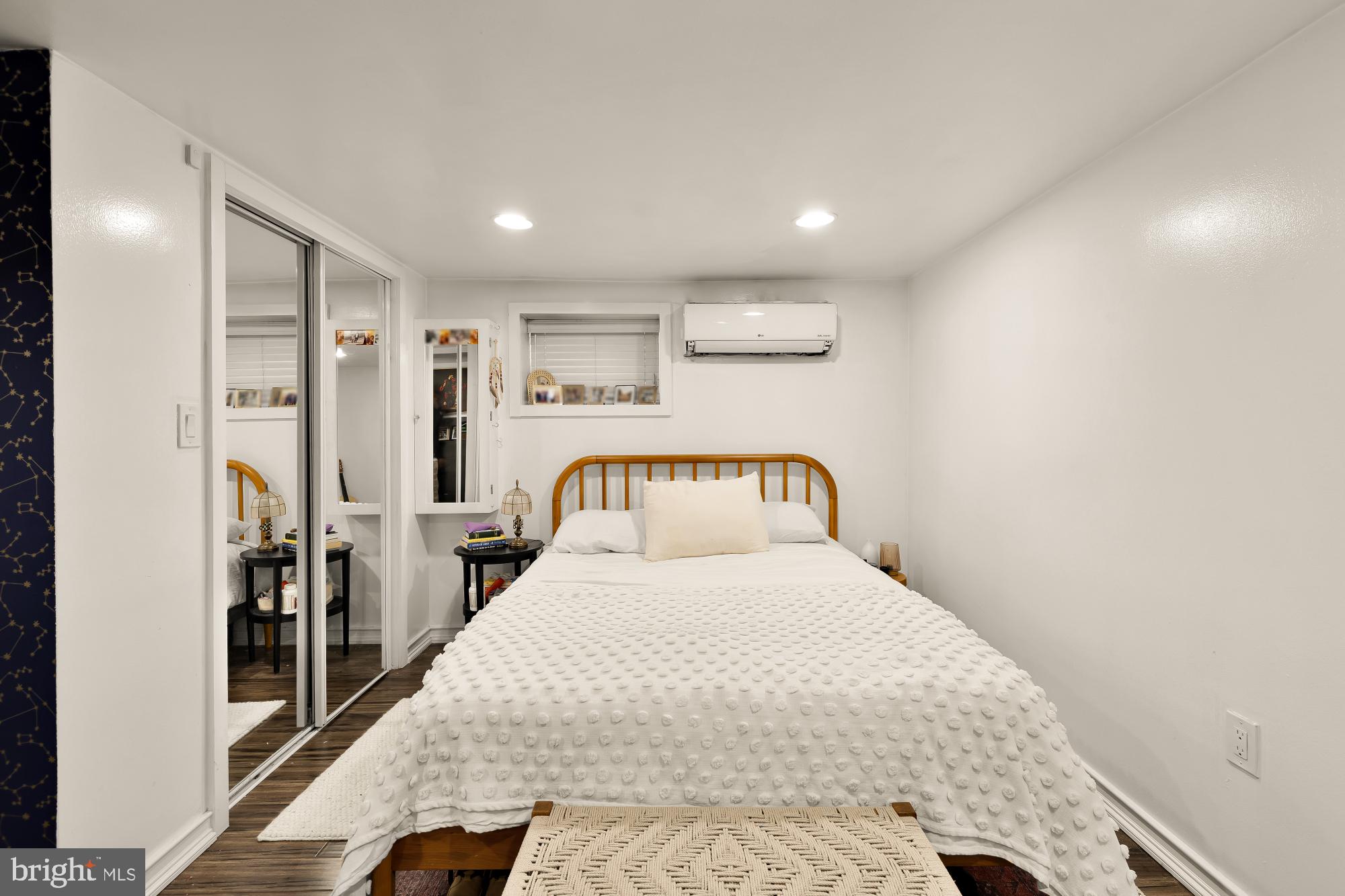 421 10th Street Northeast Washington, DC 20002 - Photo 60 of 61 a large bedroom with a bed and a large mirror