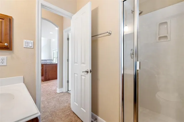 a bathroom with a sink toilet and shower