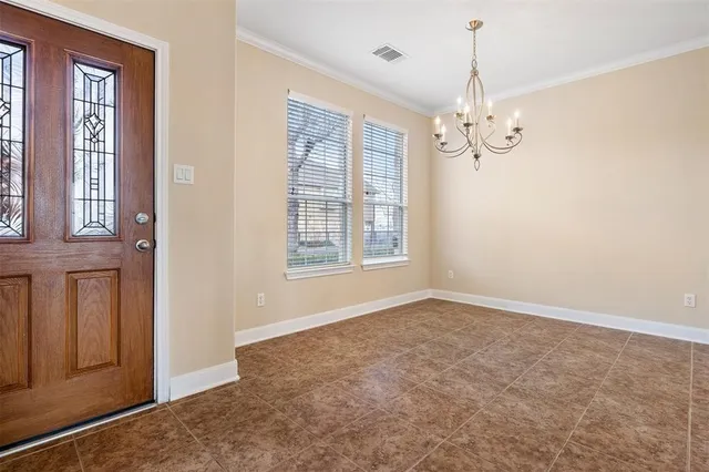 a view of a livingroom with wooden floor and stairs