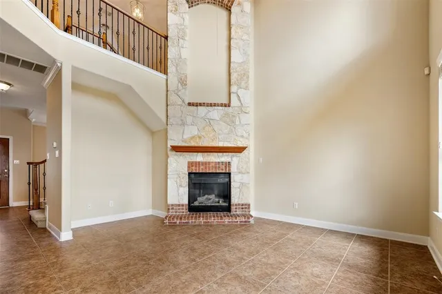 a view of a kitchen with a sink and a refrigerator