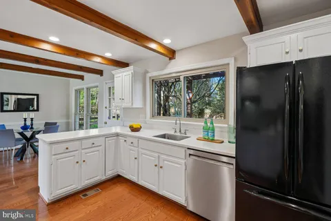 a kitchen with a refrigerator and sink