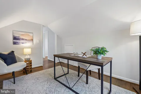 a view of a workspace with furniture