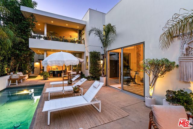 a view of a swimming pool with a patio