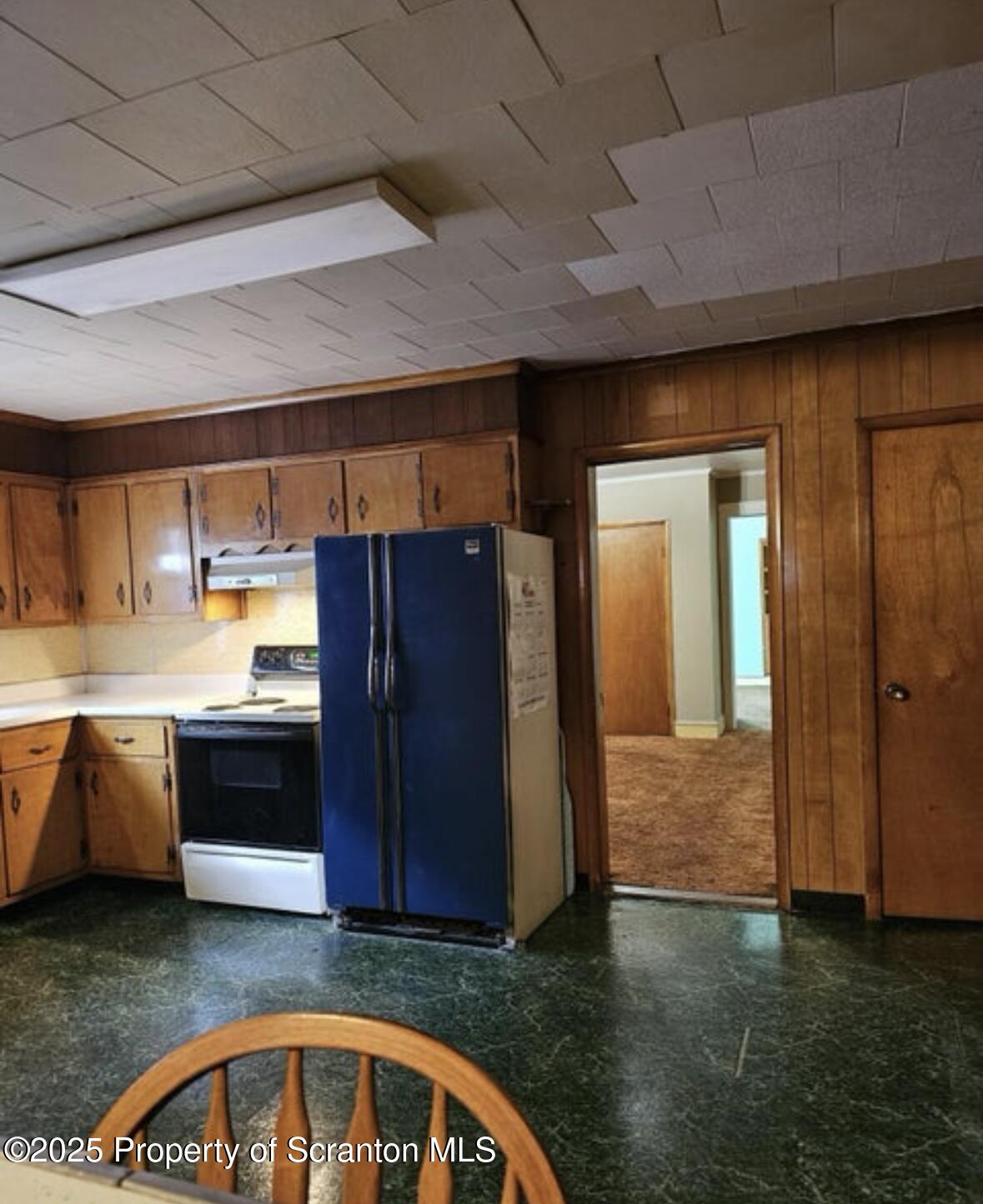 717-719 Prospect Avenue Scranton, PA 18505 - Photo 4 of 6 a view of a kitchen with a sink and dishwasher a stove top oven with wooden floor