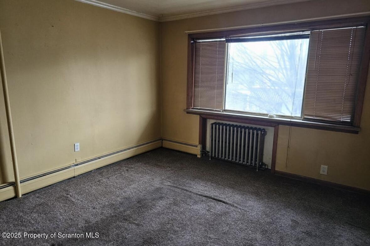 717-719 Prospect Avenue Scranton, PA 18505 - Photo 6 of 6 a view of an empty room with a window