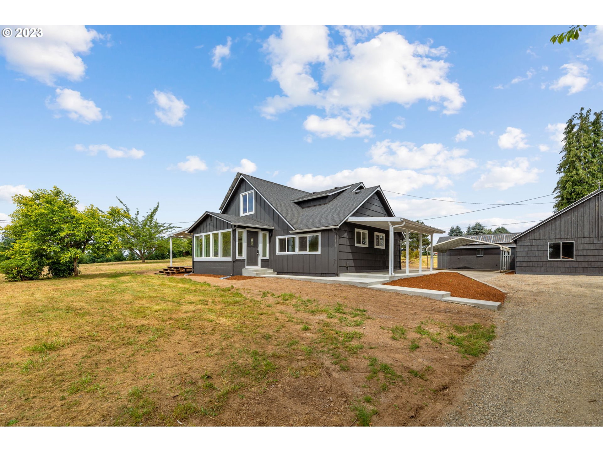 19308 Northeast Davis Road Brush Prairie, WA 98606 - Photo 1 of 45 a front view of a house with a yard