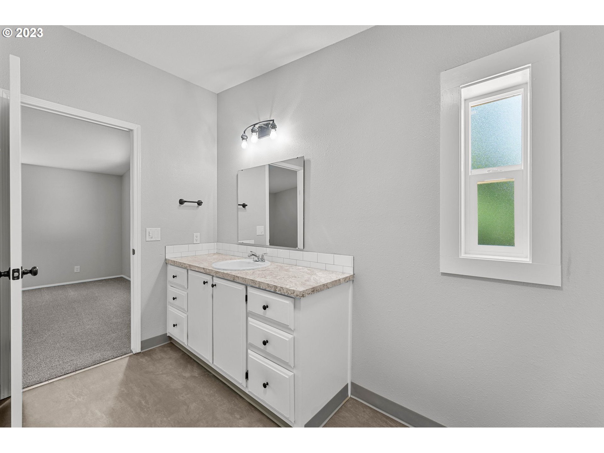 19308 Northeast Davis Road Brush Prairie, WA 98606 - Photo 42 of 45 a bathroom with a granite countertop sink mirror and a
