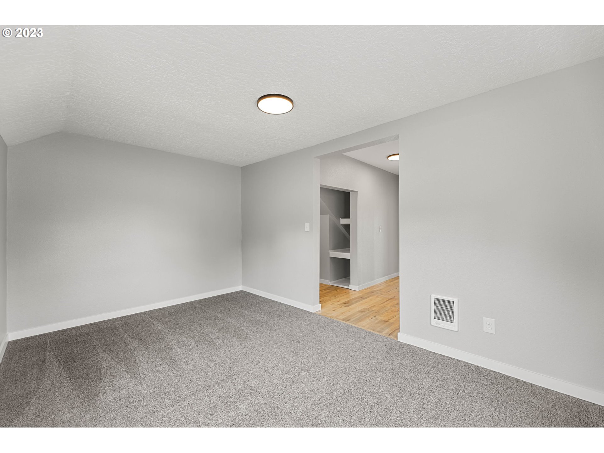 19308 Northeast Davis Road Brush Prairie, WA 98606 - Photo 9 of 45 a view of an empty room with wooden floor