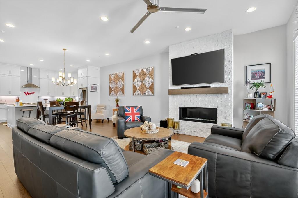 304 Liberty Way Woodstock, GA 30188 - Photo 16 of 42 a living room with furniture fireplace and flat screen tv