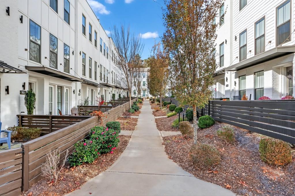 304 Liberty Way Woodstock, GA 30188 - Photo 27 of 42 a view of a pathway both side of house
