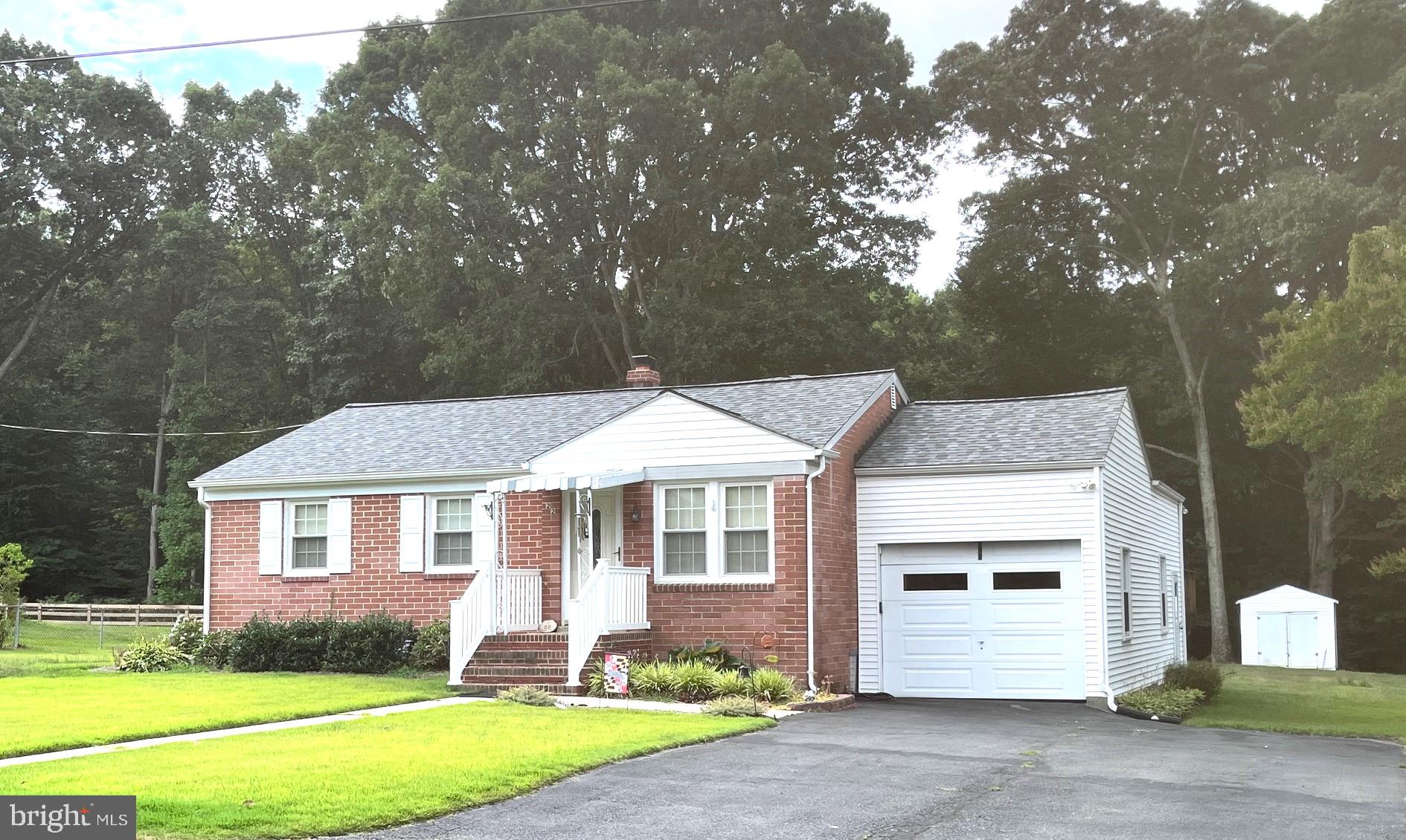 22 Robshire Manor Road Huntingtown, MD 20639 - Photo 1 of 44 a front view of a house with garden