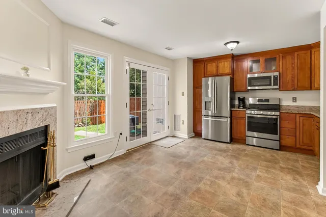 a view of a kitchen with a stove cabinets and a kitchen