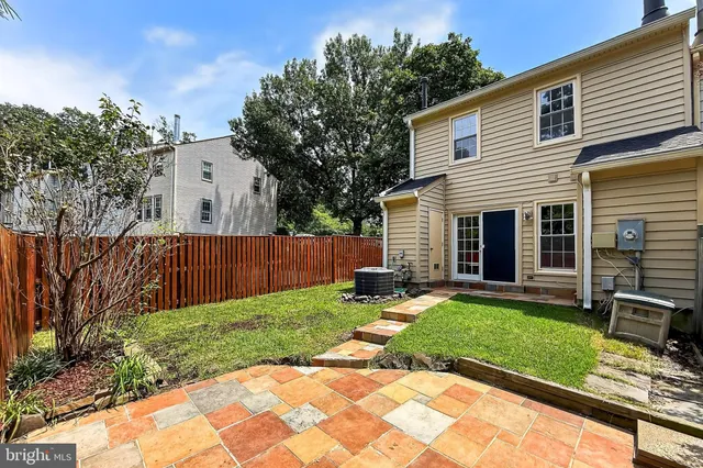 a backyard of a house with seating space