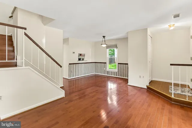 a view of a livingroom with wooden floor